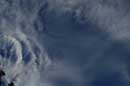 Newly formed clouds with uniform droplet size start to iridesce as they move near the sun (lower left), August 7, 2004 - � 2004 Lauri Kangas
